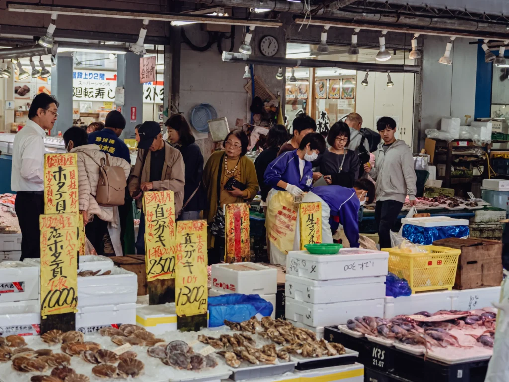 Various fresh fish and seafood displayed on ice at a stall in Nakaminato Fish 