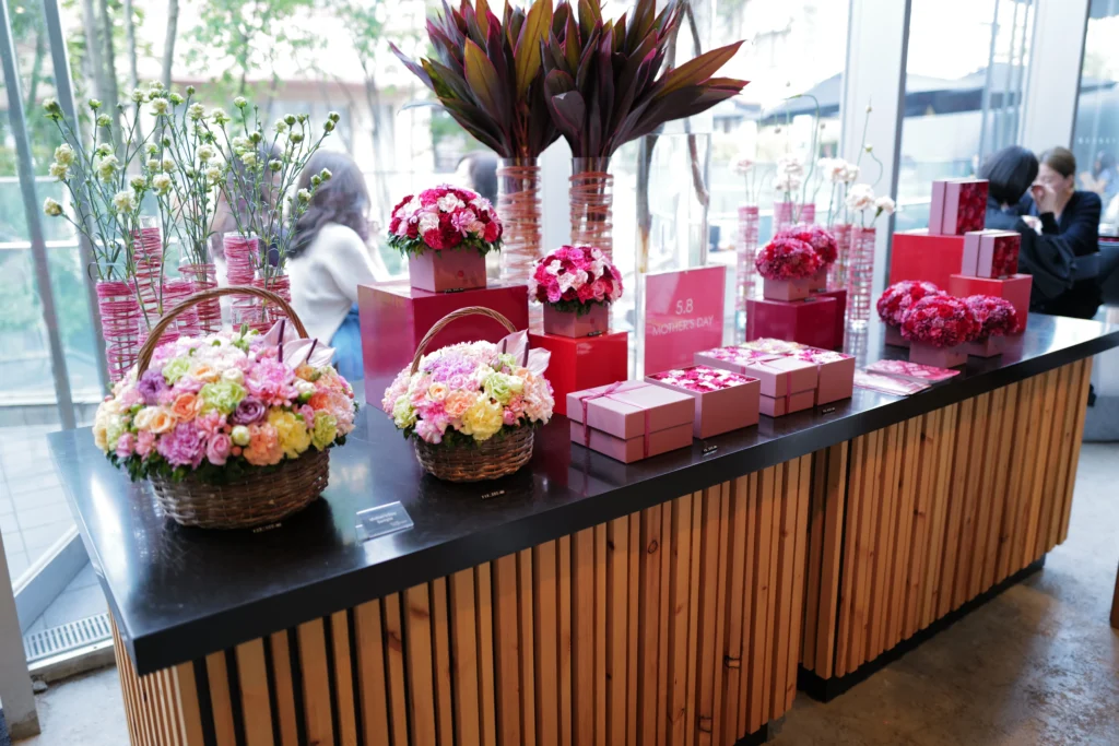 A display of Nicolai Bergmann's famous preserved flower boxes and fresh flower arrangements.