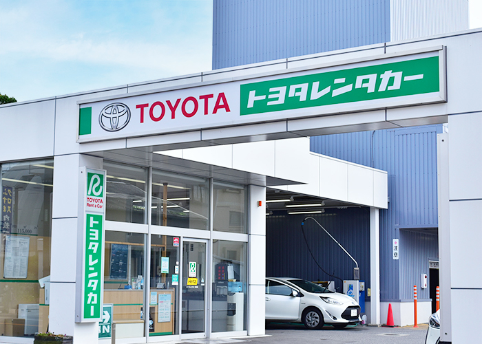 The storefront of a Toyota Rent a Car location, an option for traveling from Tokyo to Kawaguchiko with flexibility.