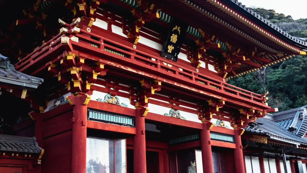 A close-up of the ornate, brightly colored architecture of the Main Hall's gate.