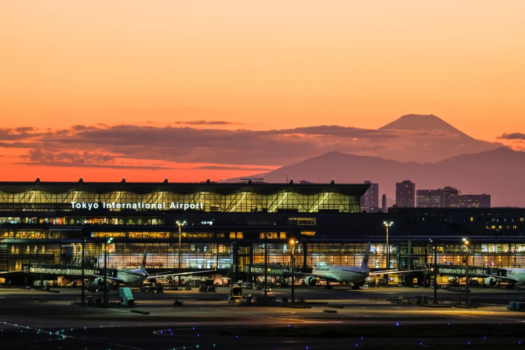 Haneda Airport at sunset with Mt. Fuji in the background