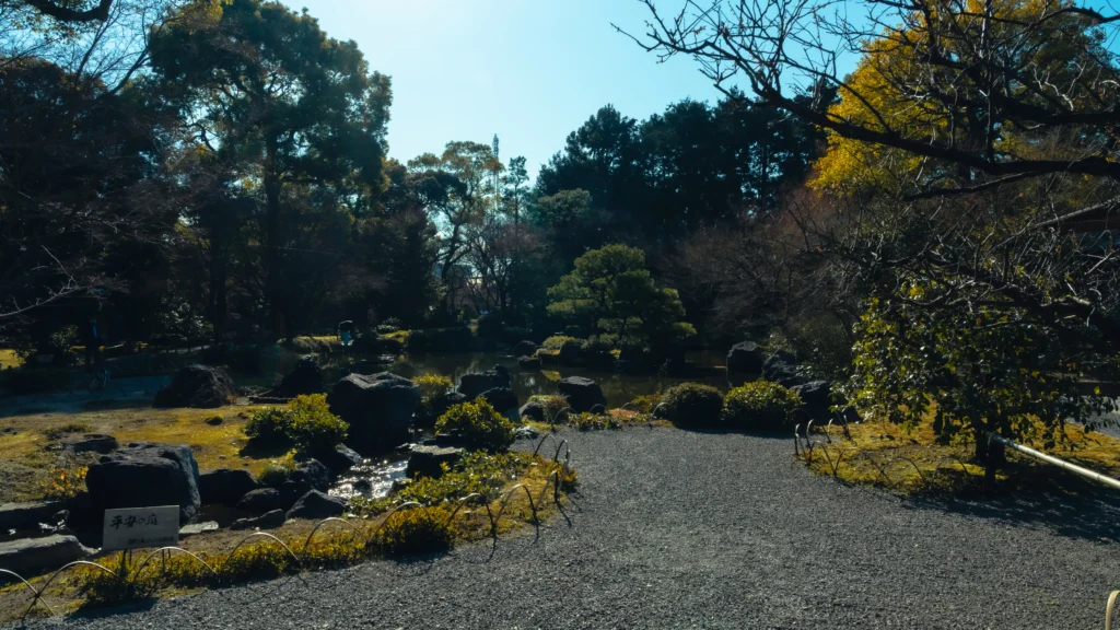 A tranquil pond and bridge in the Rakusuien garden at Jonangu Shrine