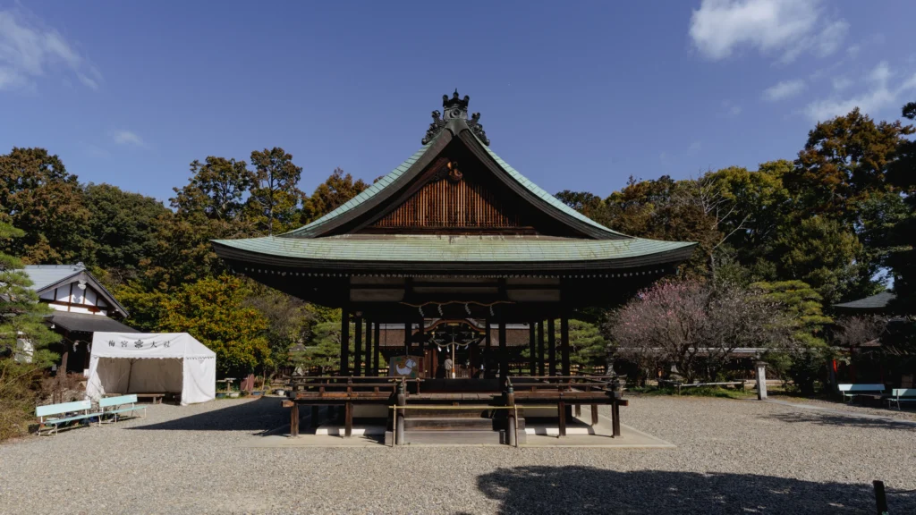 The Butai (stage) with blooming plum blossoms in the foreground.