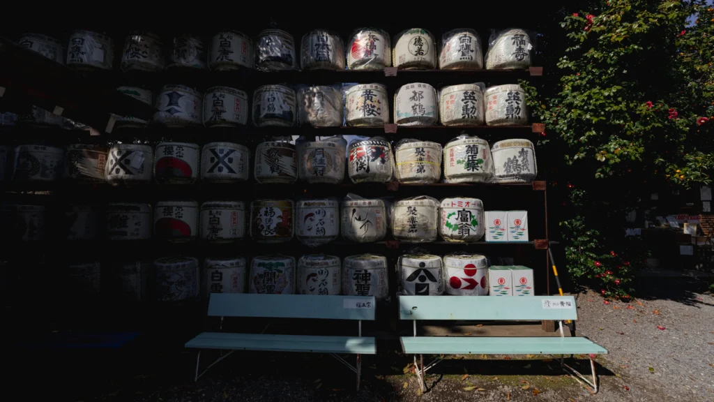 A wall of sake barrels (komodaru) offered to the deities at Umenomiya Taisha.
