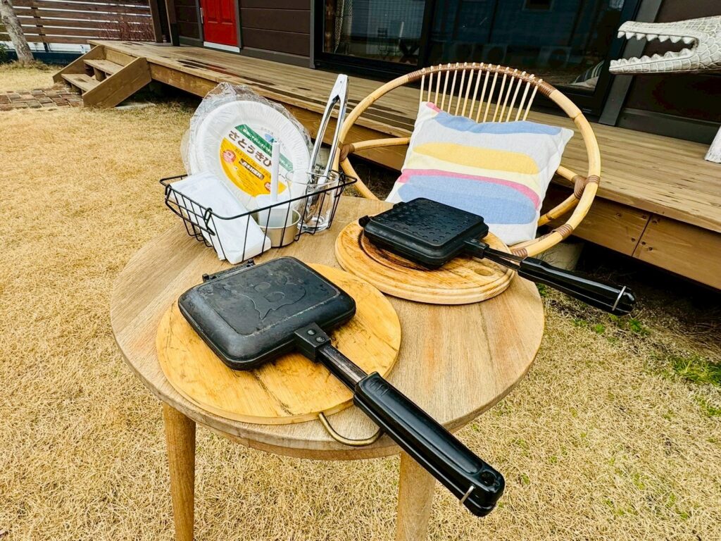 A hot sandwich making set on the outdoor terrace at BESS Kumamoto, using a BESS-branded sandwich maker.
