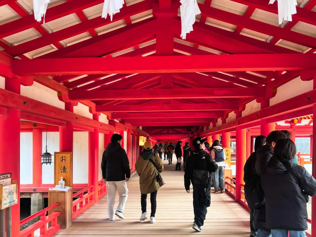 Inside the vermillion corridors of Itsukushima Shrine