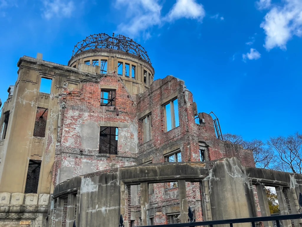 Exposed brick walls and empty window frames of the Atomic Bomb Dome