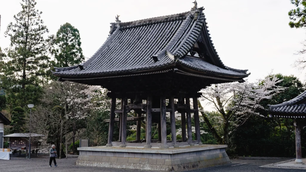 Kuonji Temple bell tower surrounded by cherry blossoms in spring
