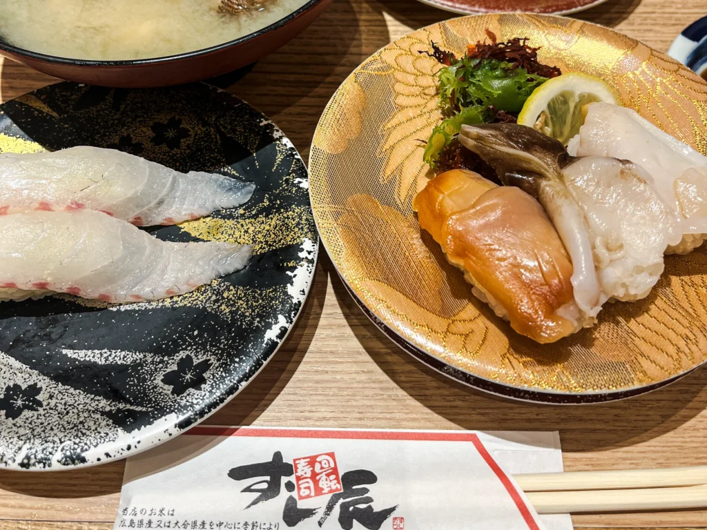 A spread of Seto Inland Sea sushi at Sushi Tatsu — octopus, white fish, and asari clam miso soup

