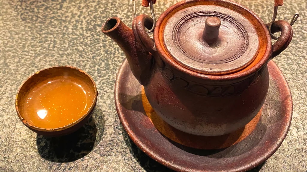 Dobin-mushi served in an earthenware teapot with a small cup of golden broth.