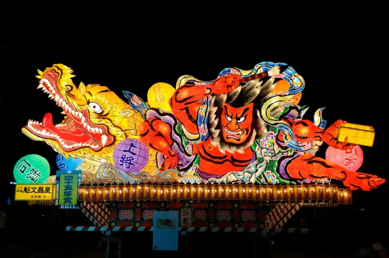 Illuminated Nebuta float depicting a warrior and dragon at the Aomori summer festival