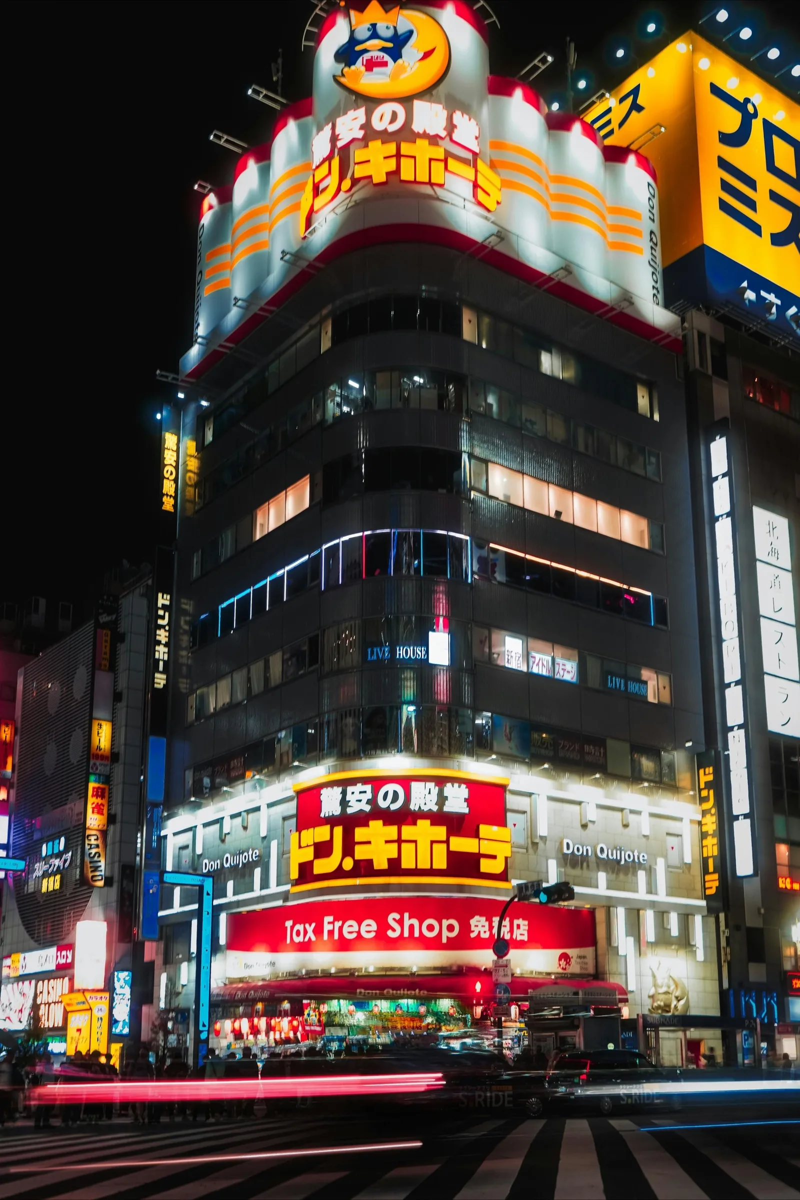 Don Quijote discount store in Shinjuku Kabukicho at night with visible Tax Free Shop sign