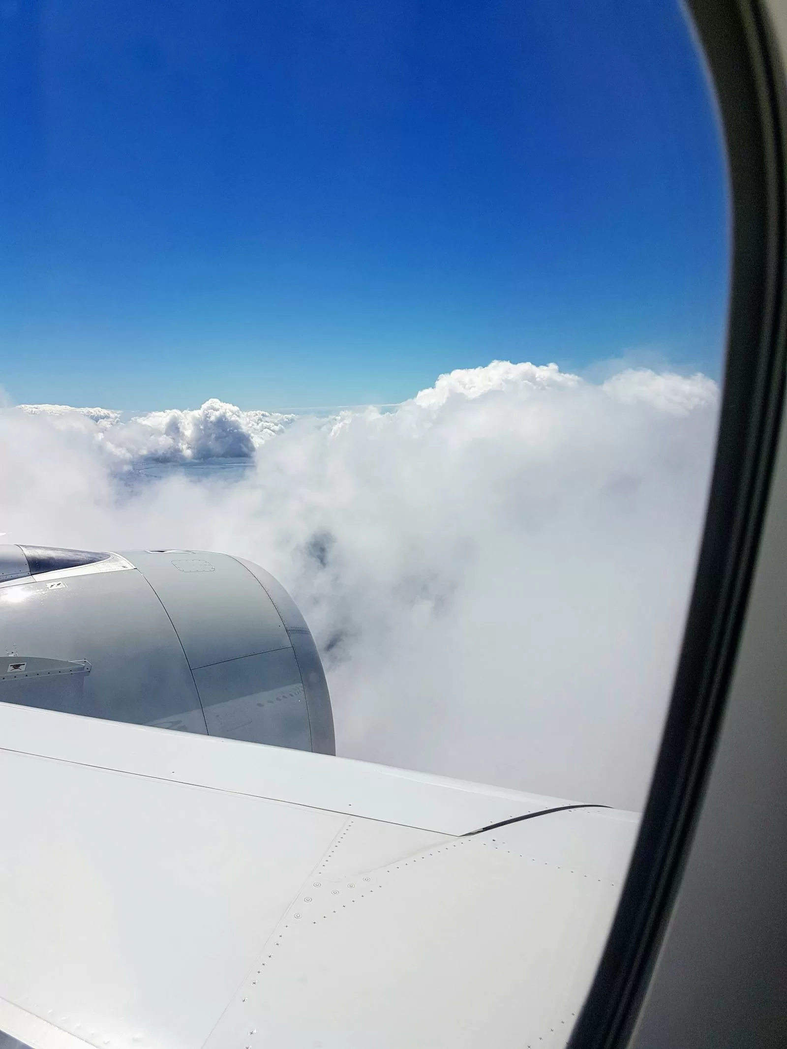 View from airplane window showing clouds over Japan