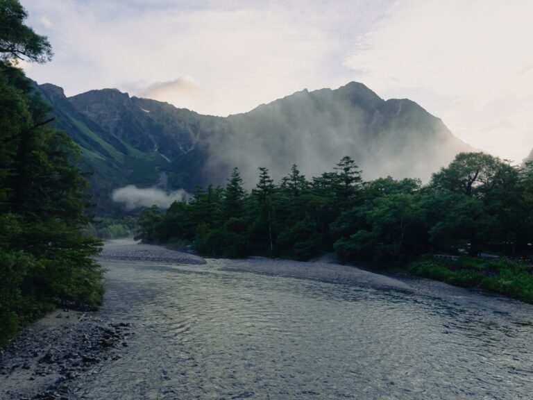 Azusa River with morning mist swirling around Hotaka peaks in Kamikochi