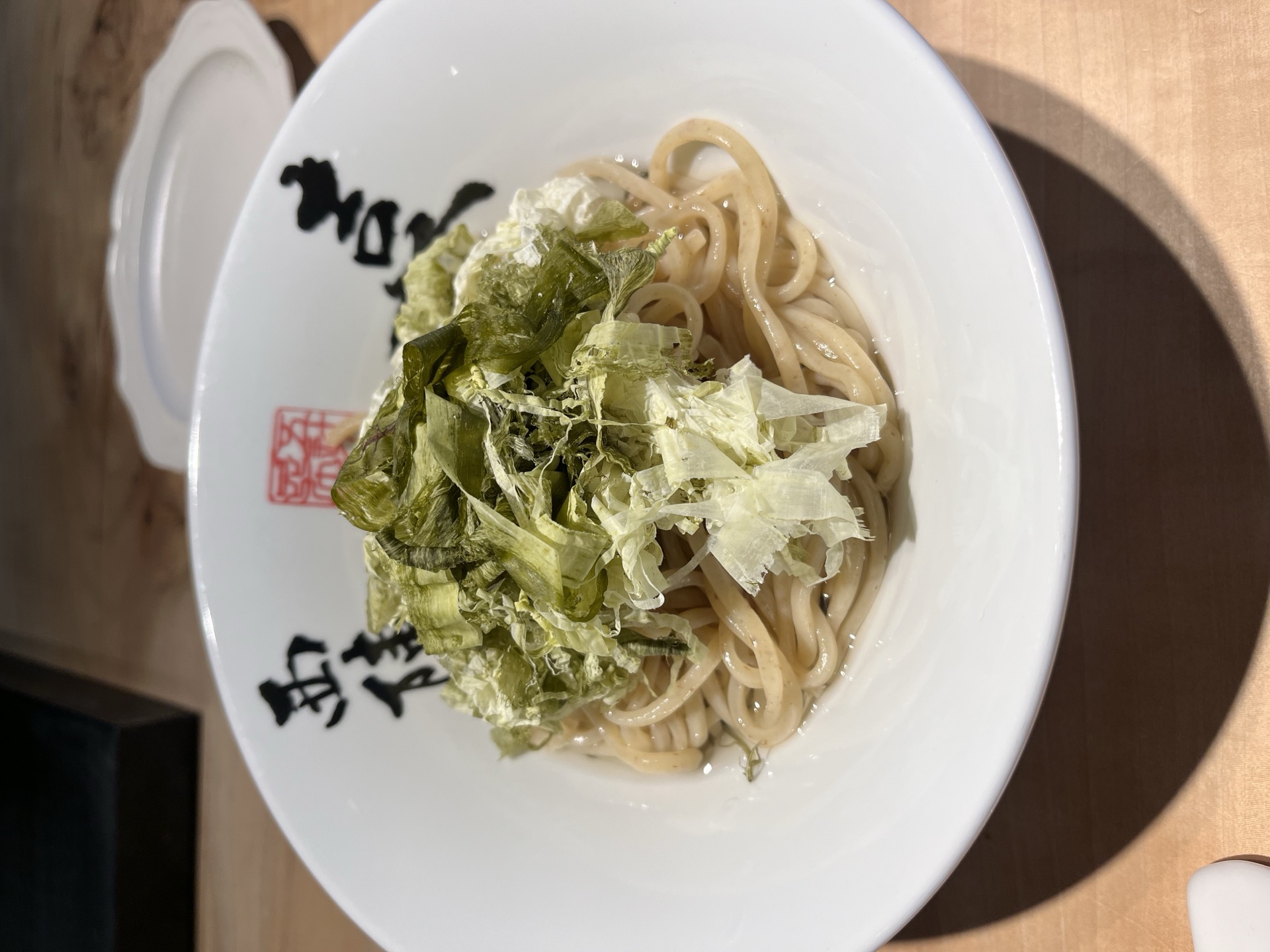 Whole-grain noodles topped with shaved oboro kombu in kombu broth at Kiichi