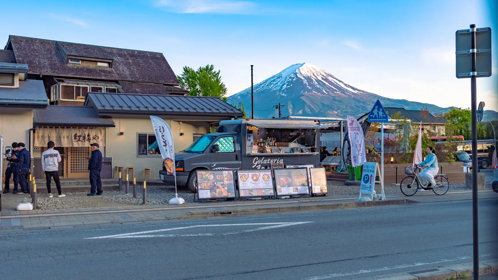 Kobaiya restaurant street view in Fujikawaguchiko with customer on bicycle