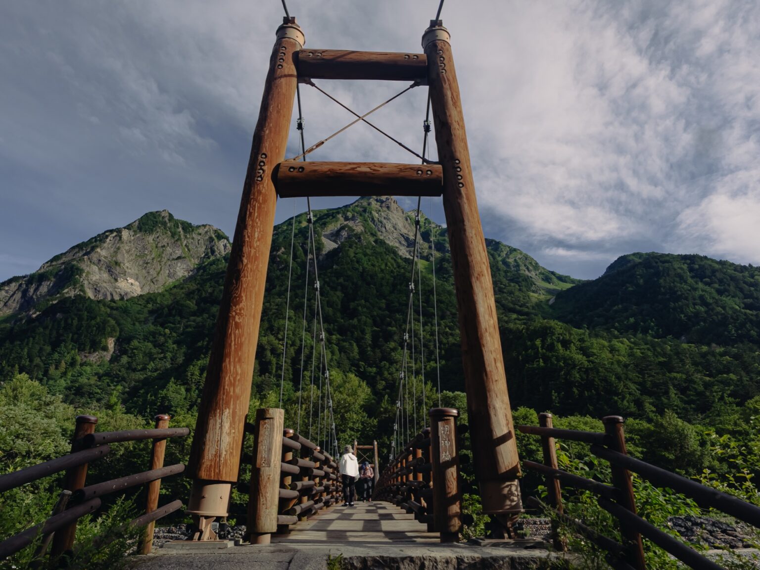 Myojin Bridge wooden suspension bridge framing Myojin-dake mountain peak
