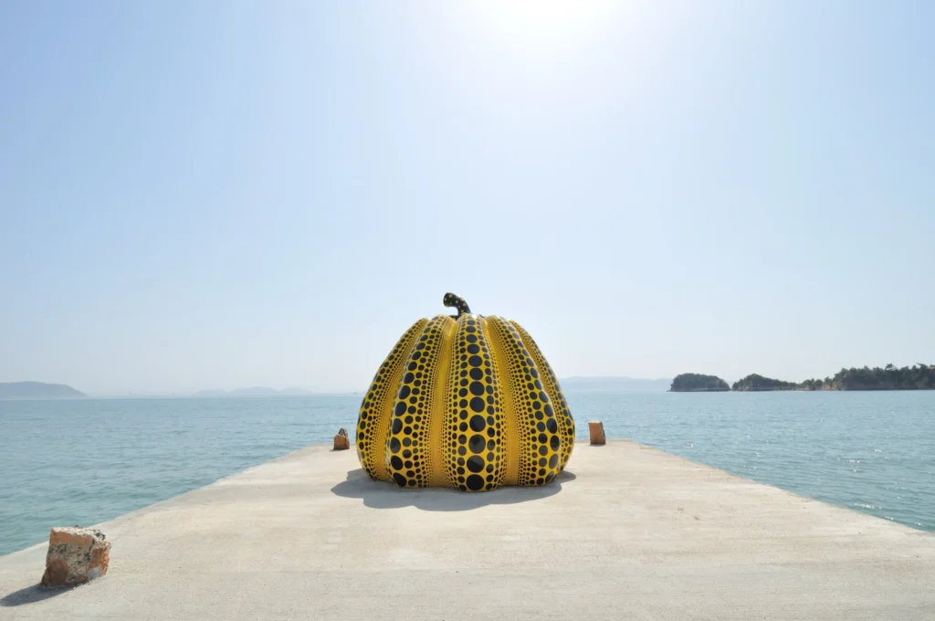 Yayoi Kusama yellow pumpkin on Naoshima pier