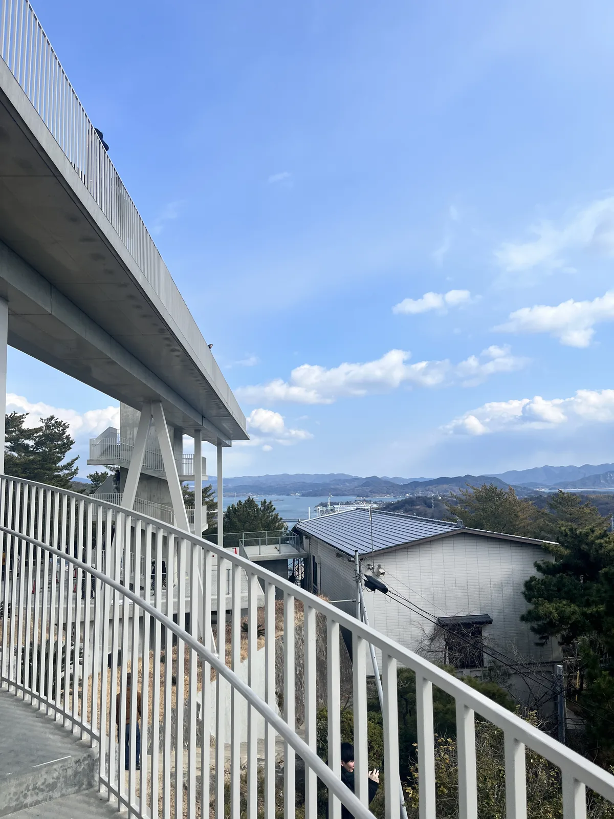 A hillside walking path in Onomichi with railings overlooking the Setouchi Inland Sea