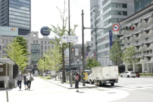 Daytime street scene at Namba 3-chome with Nankai Namba Station signage visible
