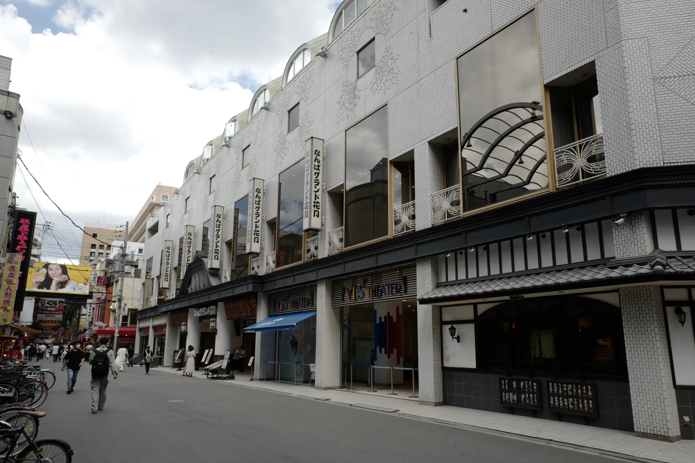 Exterior of Namba Grand Kagetsu theater with vertical banners in Osaka