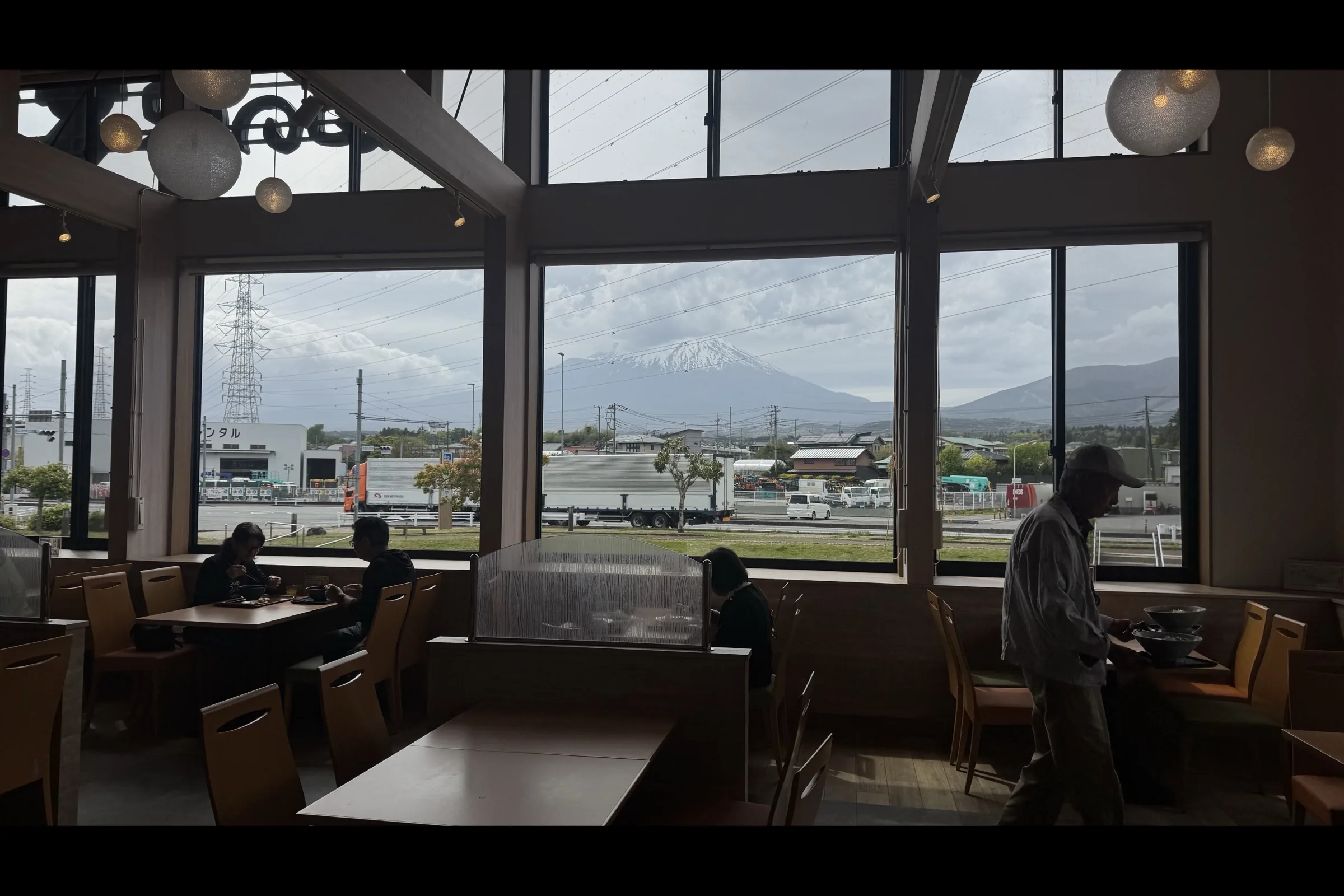 Dining hall at Michi-no-Eki Fujioyama with Mt. Fuji visible through full-height windows