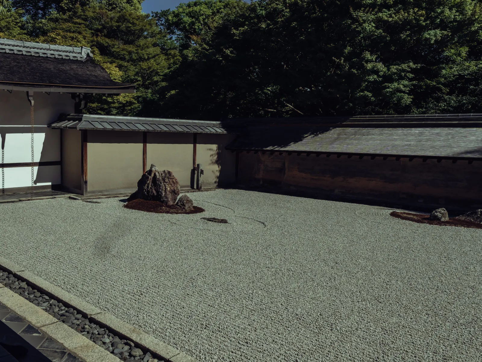 Small karesansui courtyard garden with single stone inside Ryoanji