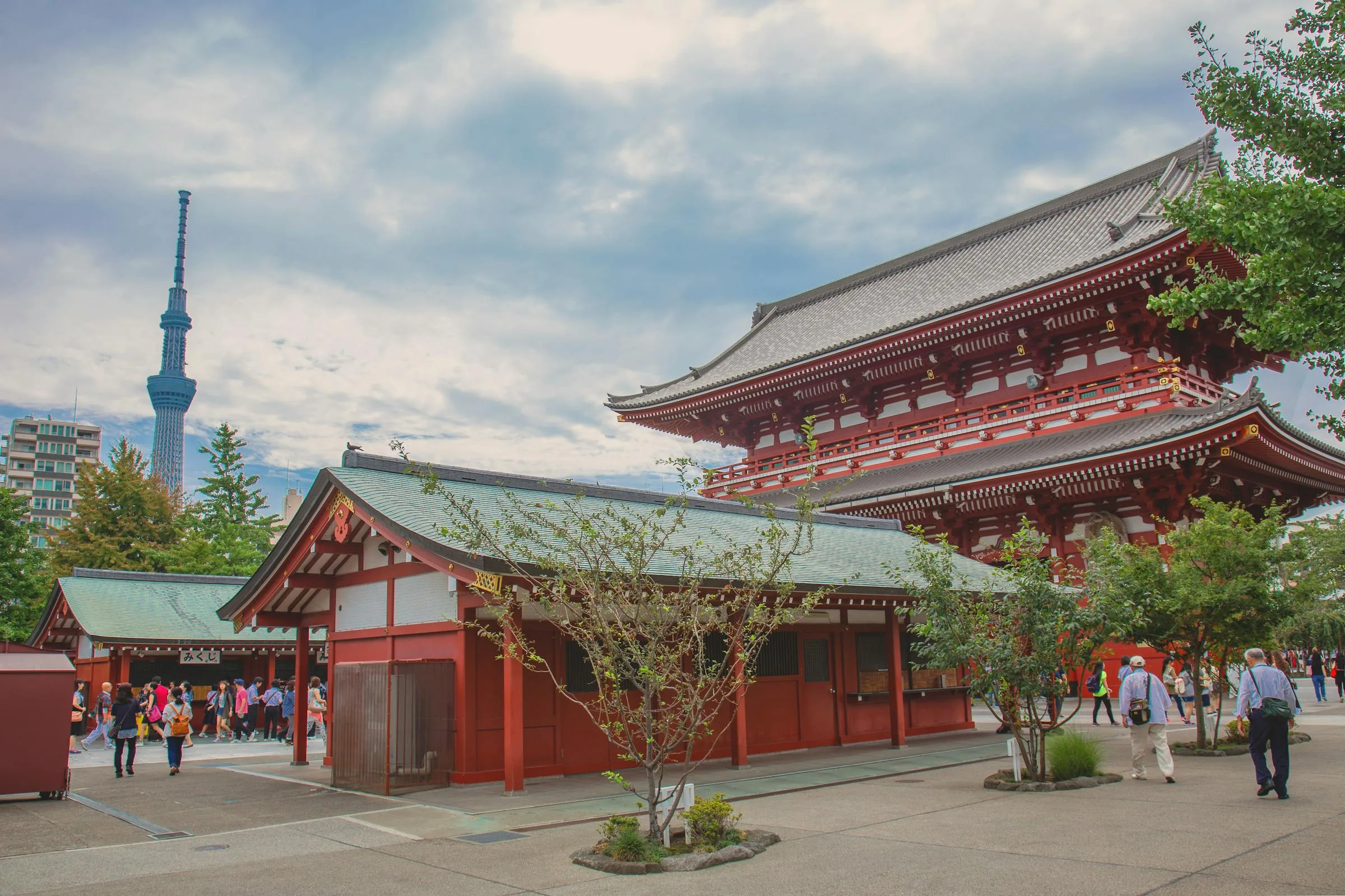 Red Sensoji Temple hall in Asakusa with the Tokyo Skytree visible in the distance