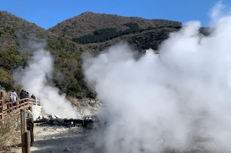 Billowing steam from Unzen Jigoku with people on walkway