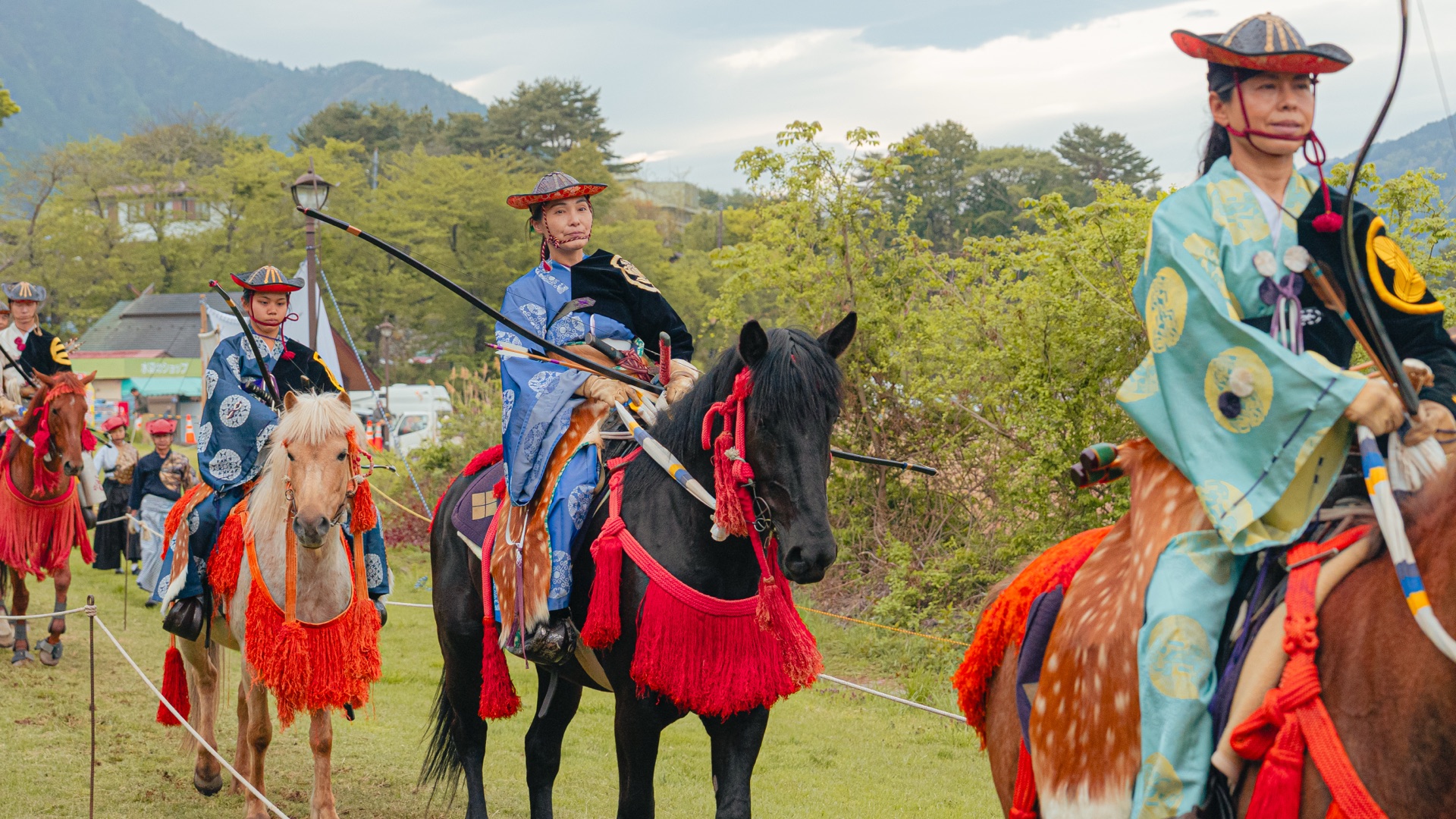 Three yabusame archers in differently colored armor lined up