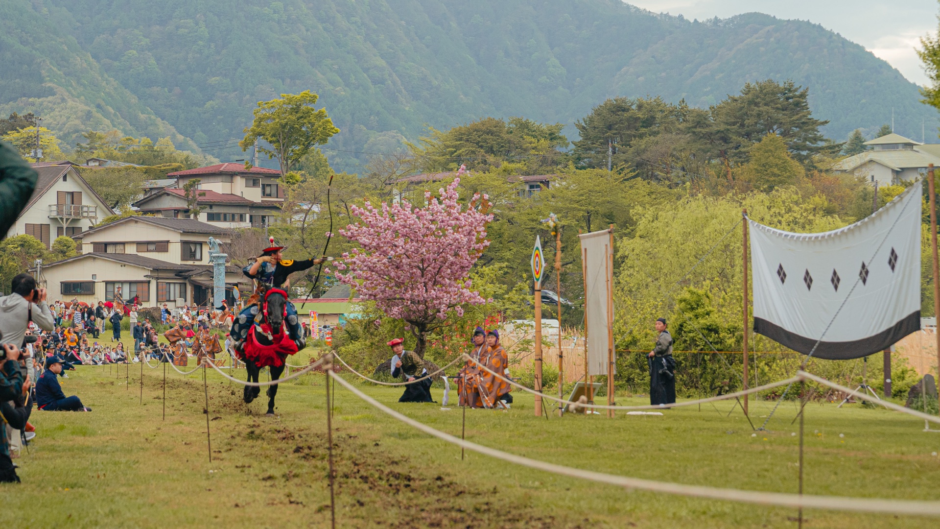 Yabusame archer with bow at full vertical extension
