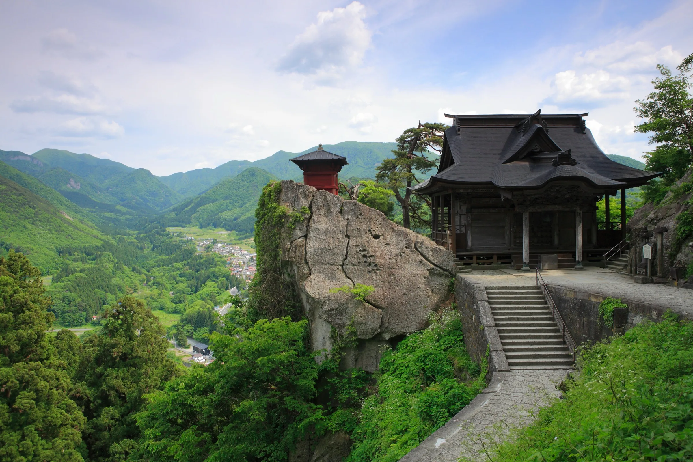 Yamadera Risshakuji Godaido temple pavilion clinging to a cliff overlooking the green Yamagata valley