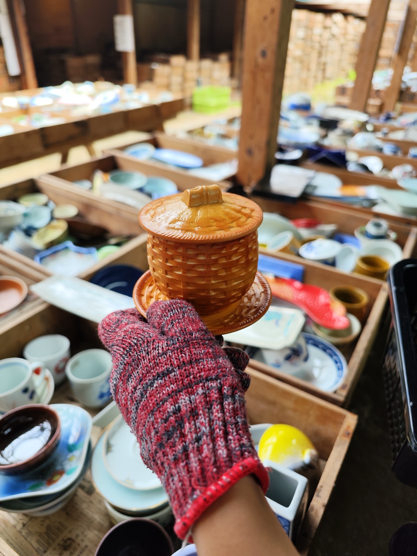Pottery rows at Kouraku-gama warehouse with natural light
