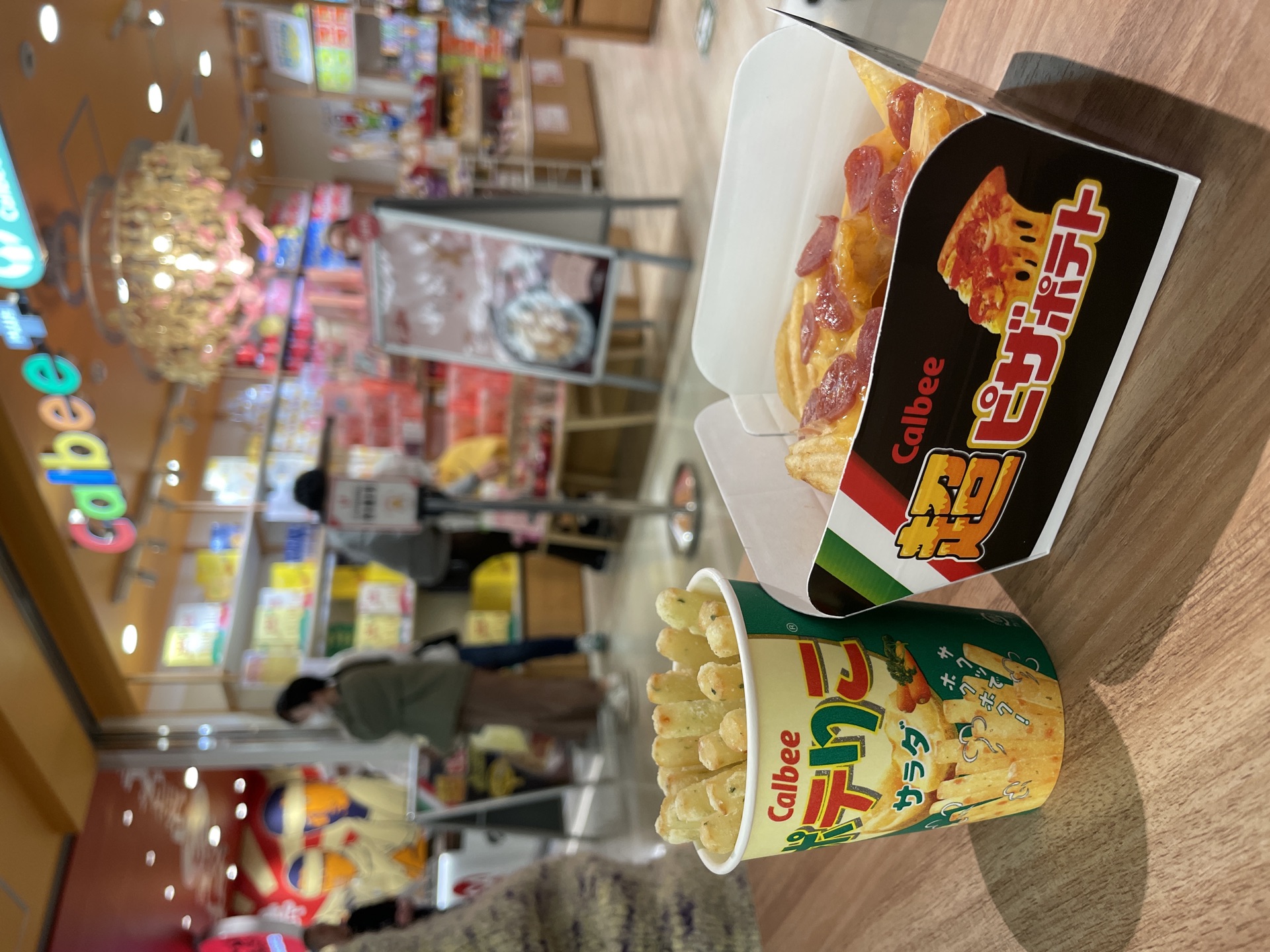 Calbee+ Ebina SA store interior with fresh Poteriko and Pizza Potato cups on table