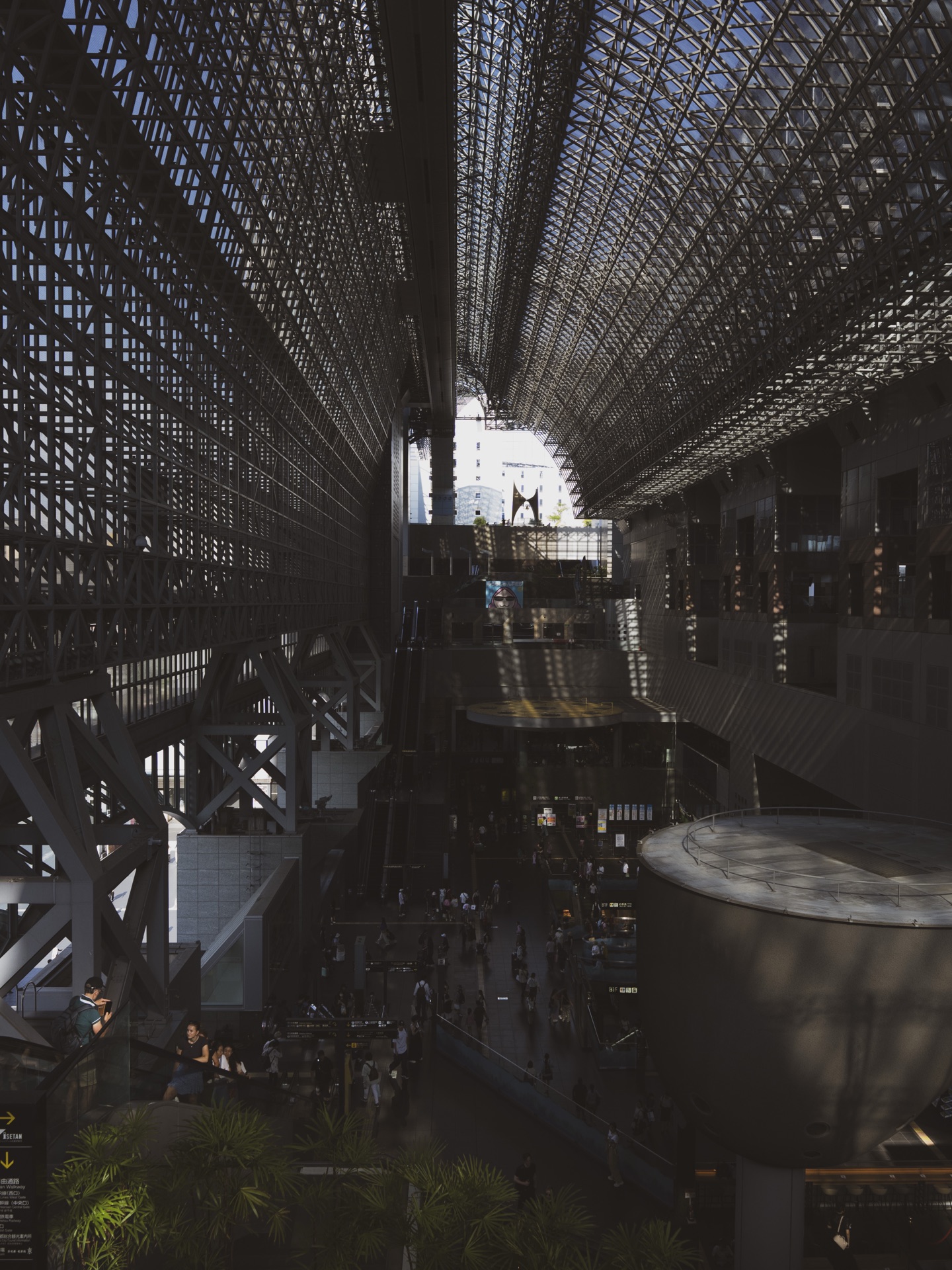 The vast Central Concourse of Kyoto Station with its lattice glass ceiling