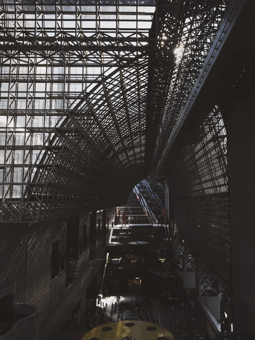Close-up detail of the latticework steel arches at Kyoto Station