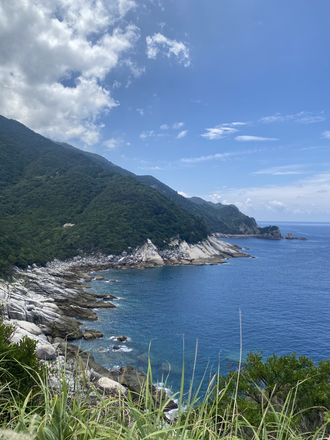 Jagged volcanic cliffs along Yakushima west coast on the morning drive