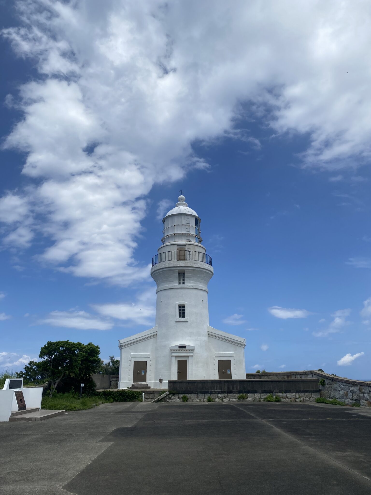 The white Nagata lighthouse standing on a cliff in northwest Yakushima