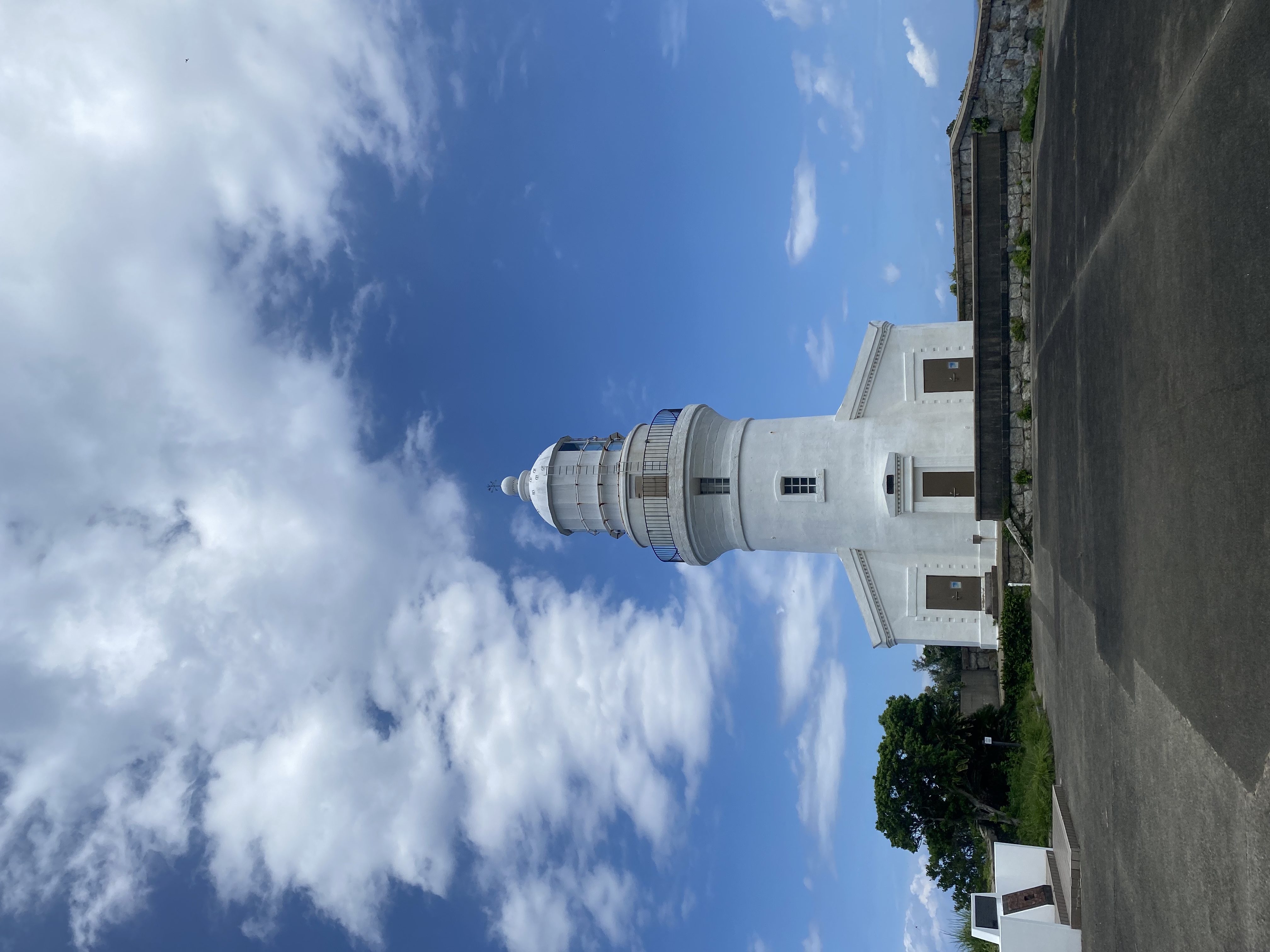 The white Nagata lighthouse standing on a cliff in northwest Yakushima