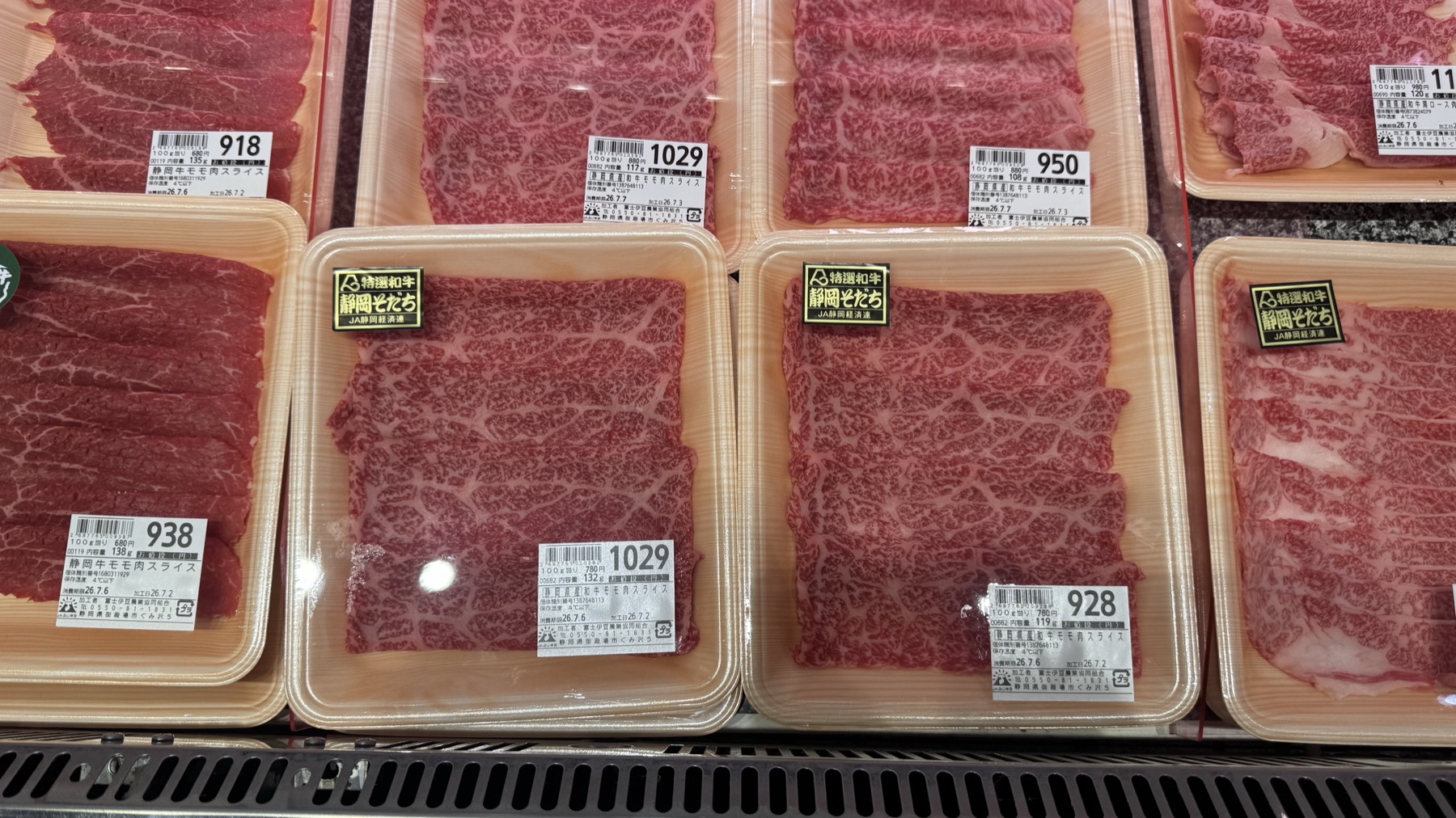 Packs of marbled Shizuoka Sodachi wagyu beef slices in the meat case at Farmers Gotemba farm-stand in Gotemba, Shizuoka