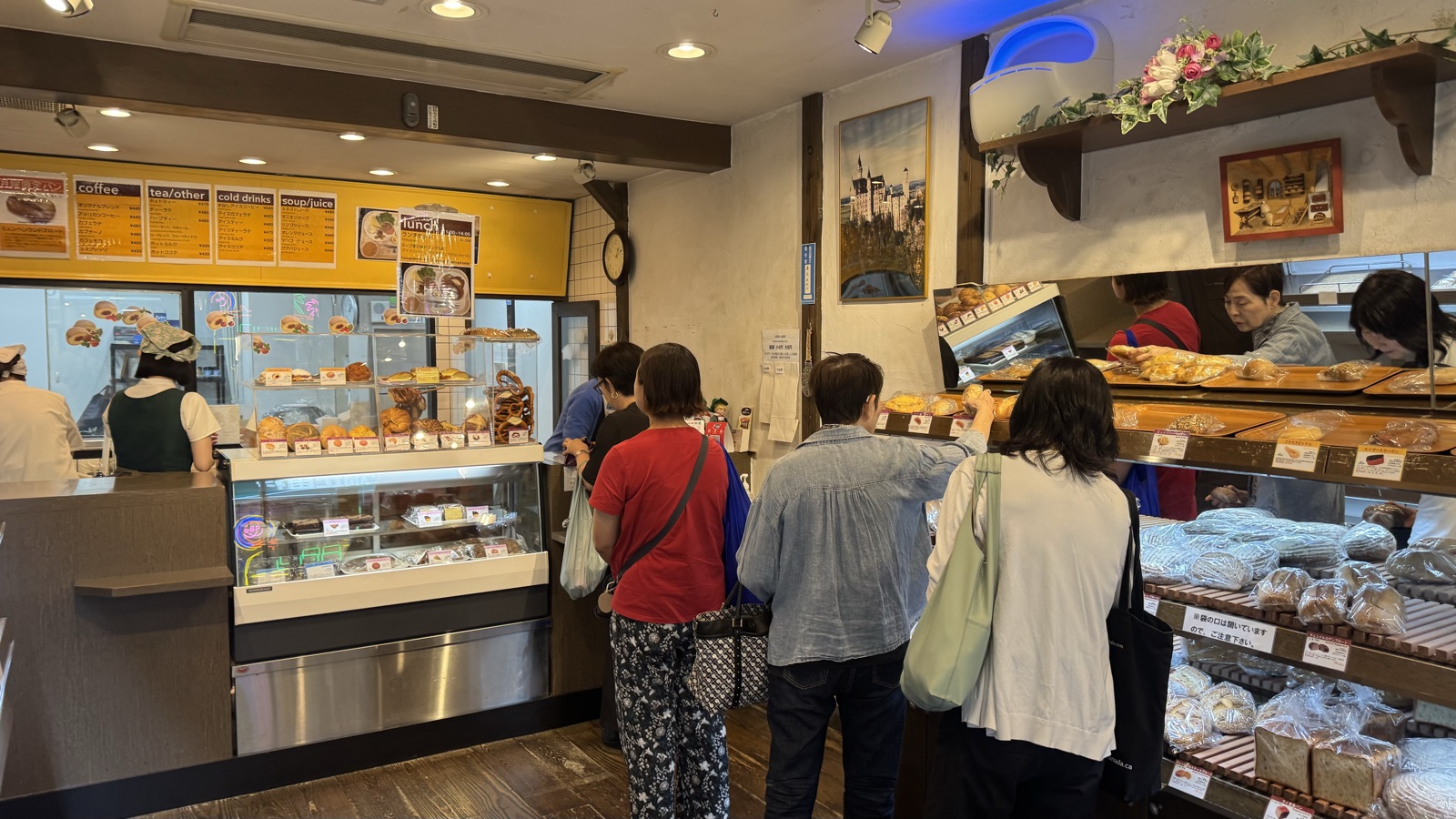 Customers lined up at the counter inside Linde bakery in Kichijoji