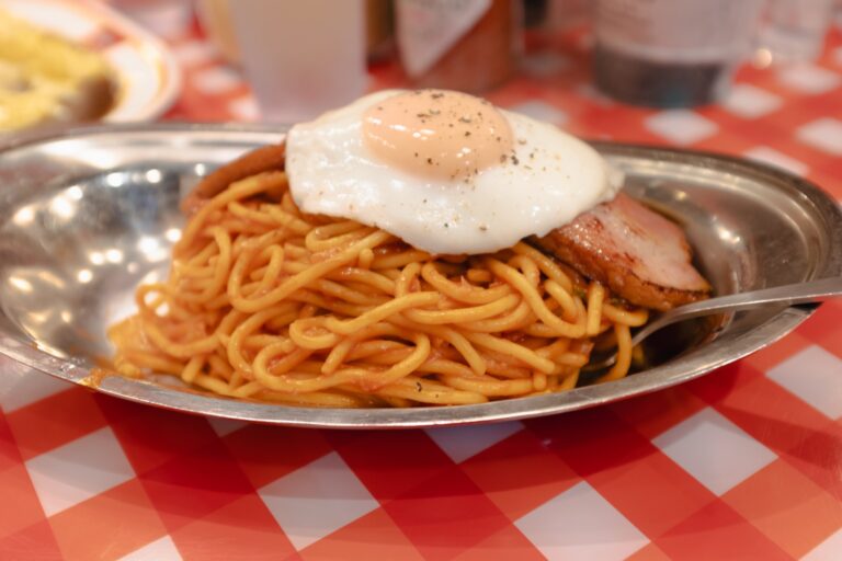 Classic Japanese napolitan topped with a fried egg at Pancho Kichijoji