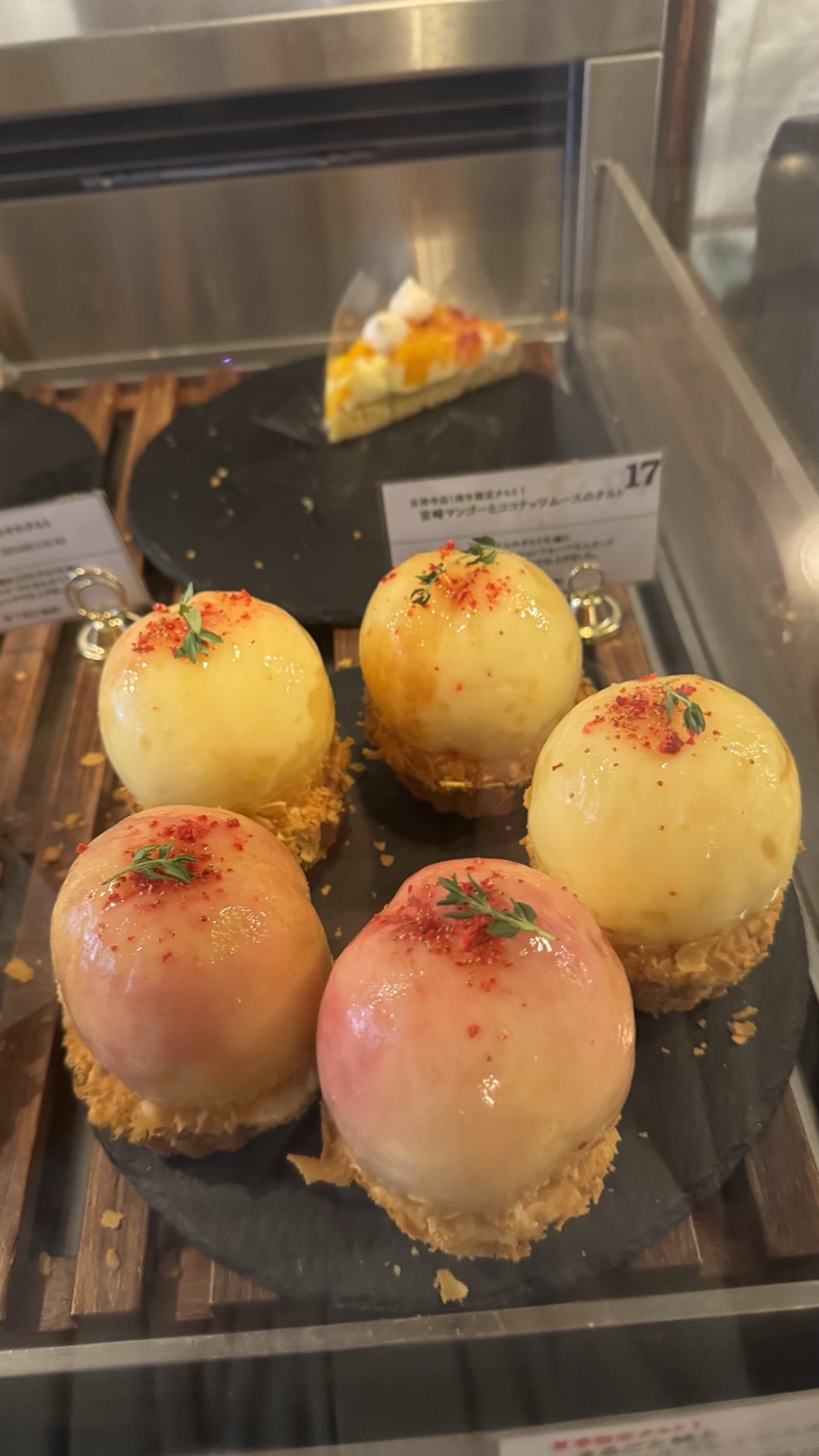 Display case of whole peach tarts at Princess Tart Kichijoji