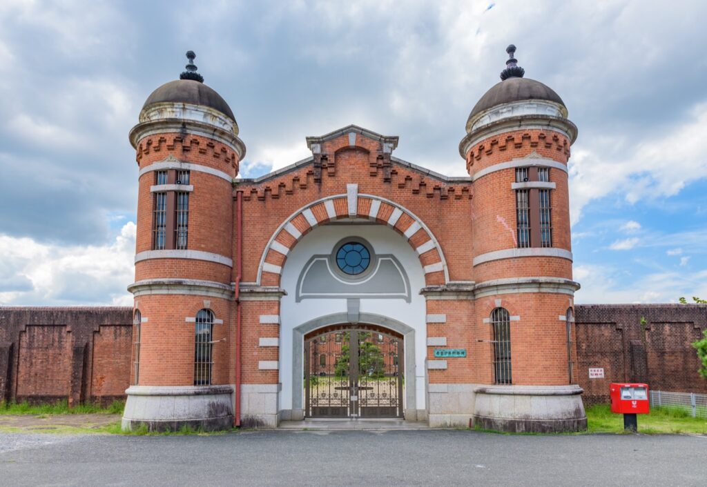 The symmetric red-brick main gate of the former Nara Prison, now the Nara Prison Museum