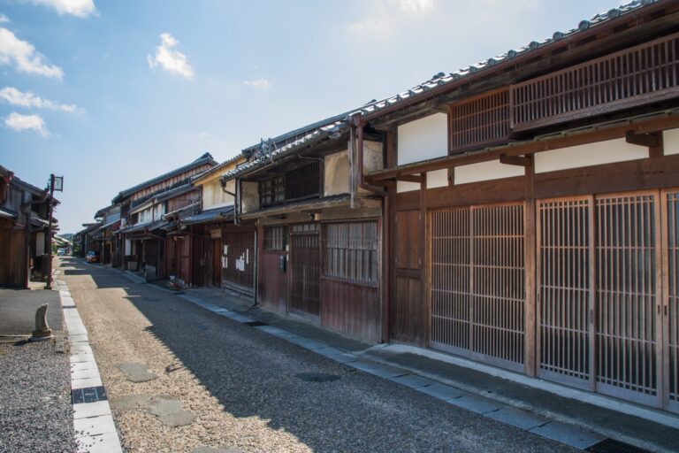 The long straight preserved street of Seki-juku the 47th Tokaido post town in Kameyama Mie lined with two-storey wooden machiya with lattice fronts and tiled roofs