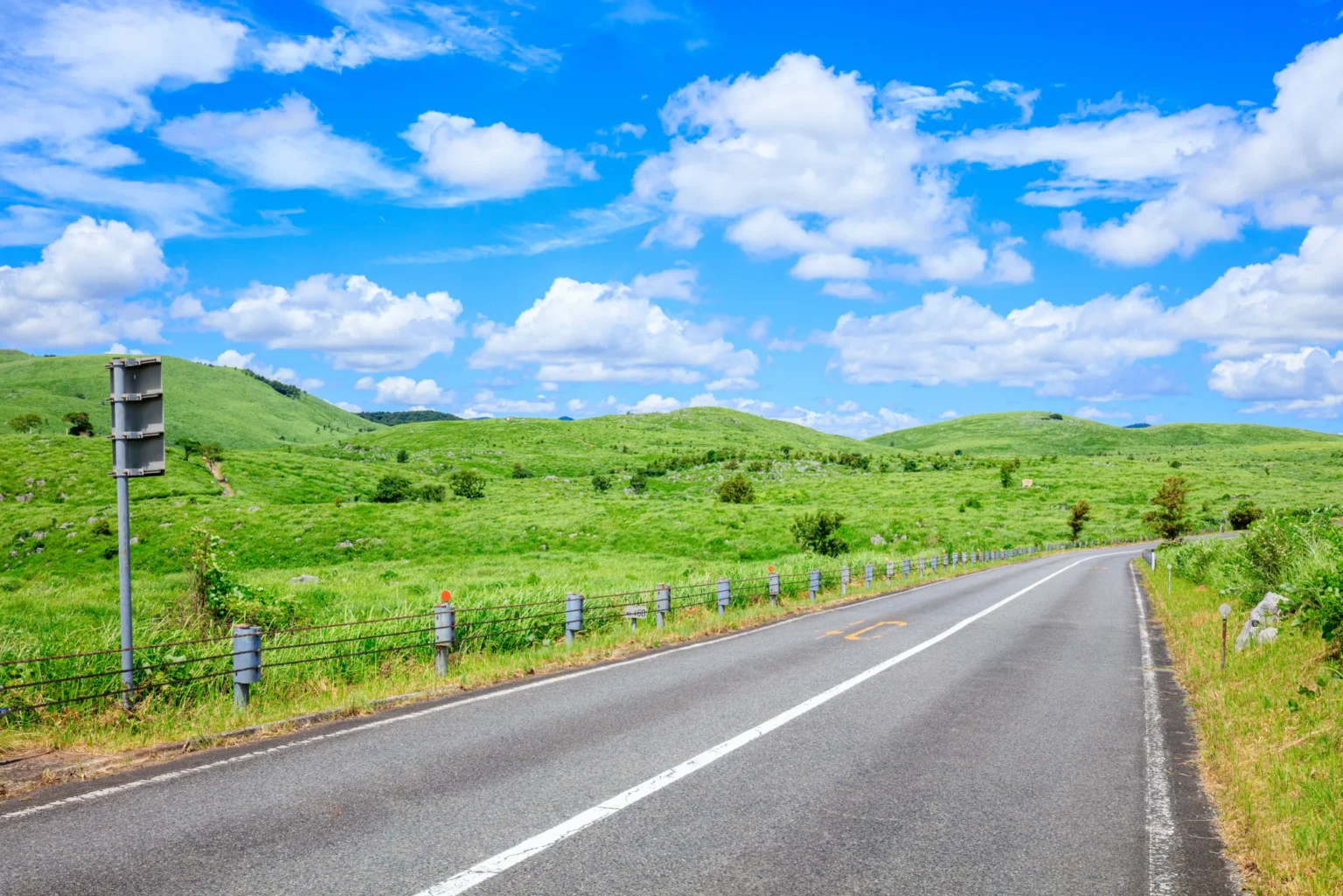 The green Akiyoshidai karst plateau in summer under a blue sky, Yamaguchi