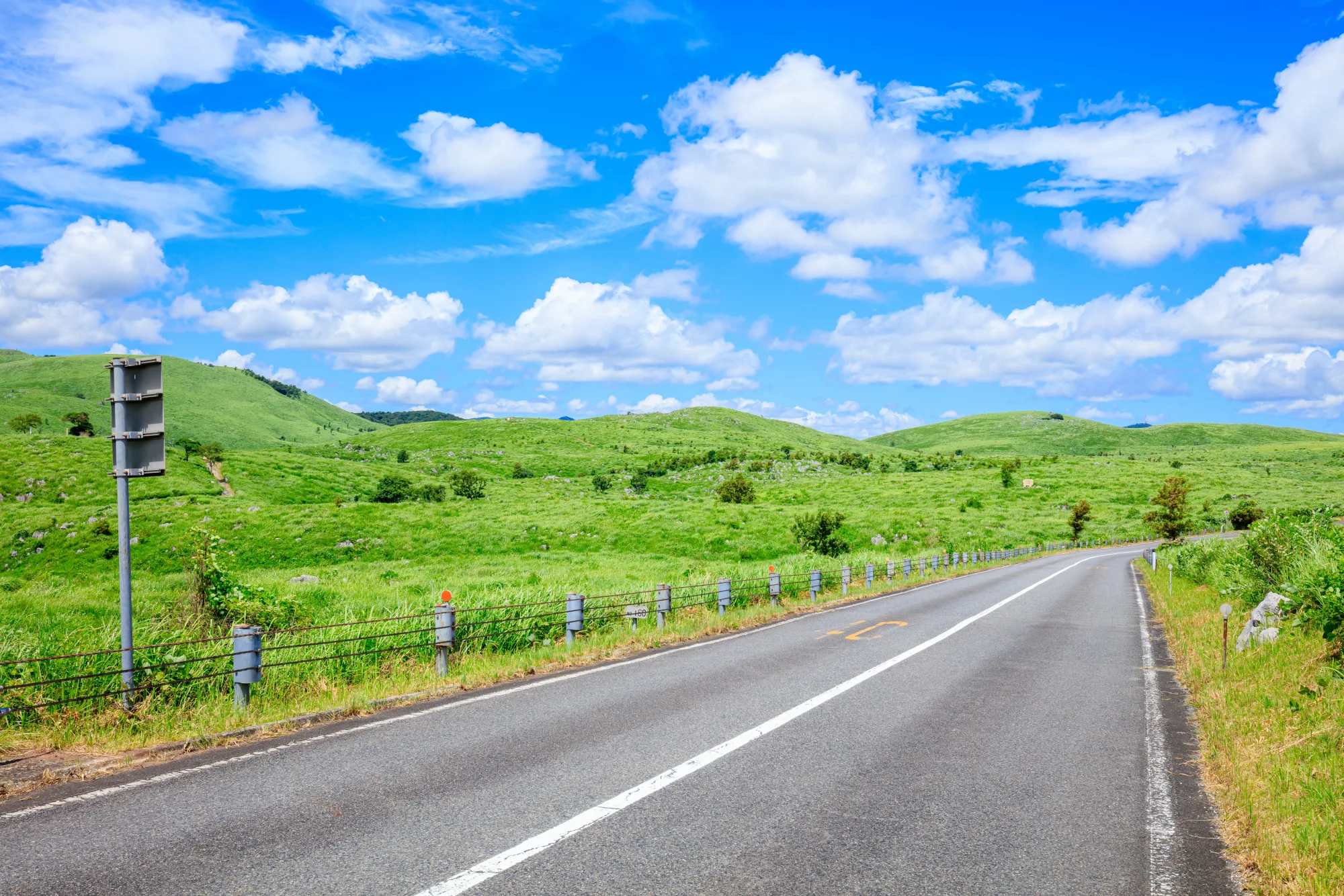 The green Akiyoshidai karst plateau in summer under a blue sky, Yamaguchi