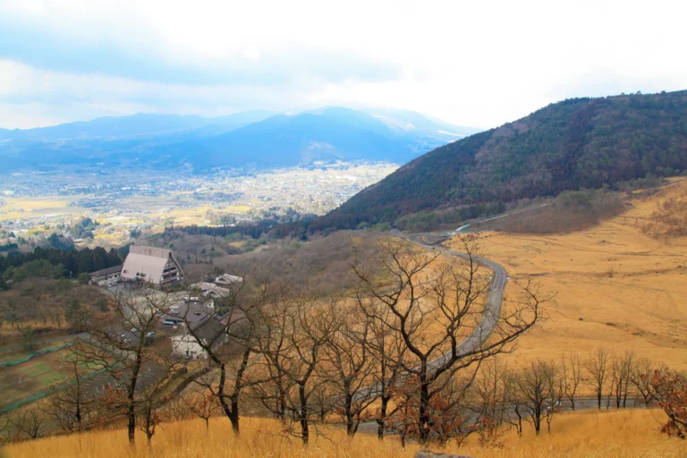 The Aso Panorama Line winding across green volcanic grassland, Kumamoto