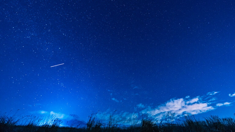Starry night sky with a streak over Mt. Fuji from Jurigi Kogen