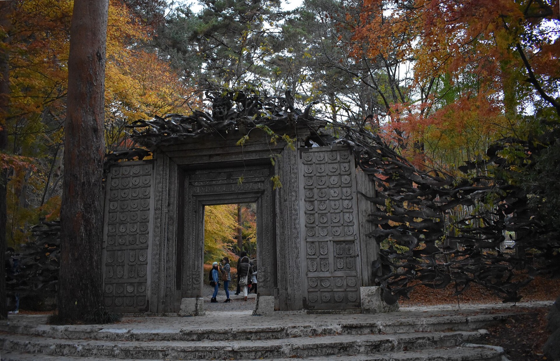 Carved gate and lush garden entrance of the Itchiku Kubota Art Museum above Lake Kawaguchiko